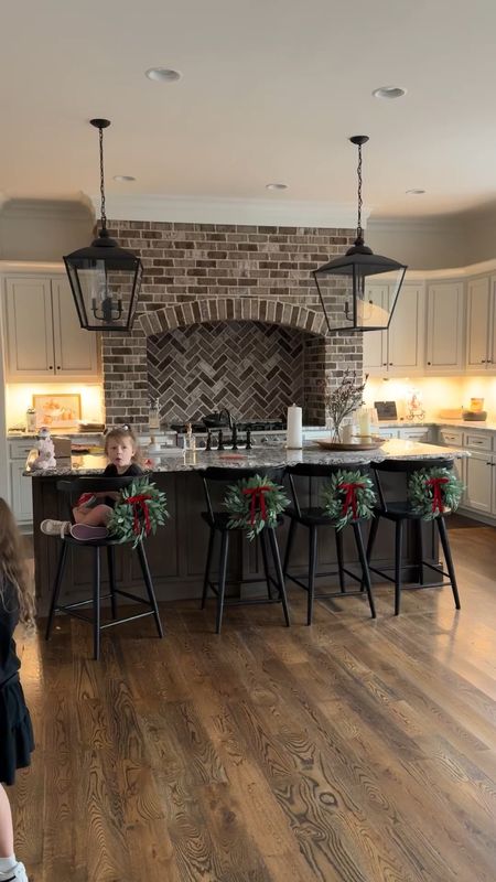 Our home decor for Christmas! ❤️ small christmqs wreaths on our counter stills chairs counter chairs black bar stool chairs countertop chair 

#LTKHoliday #LTKhome #LTKfindsunder50