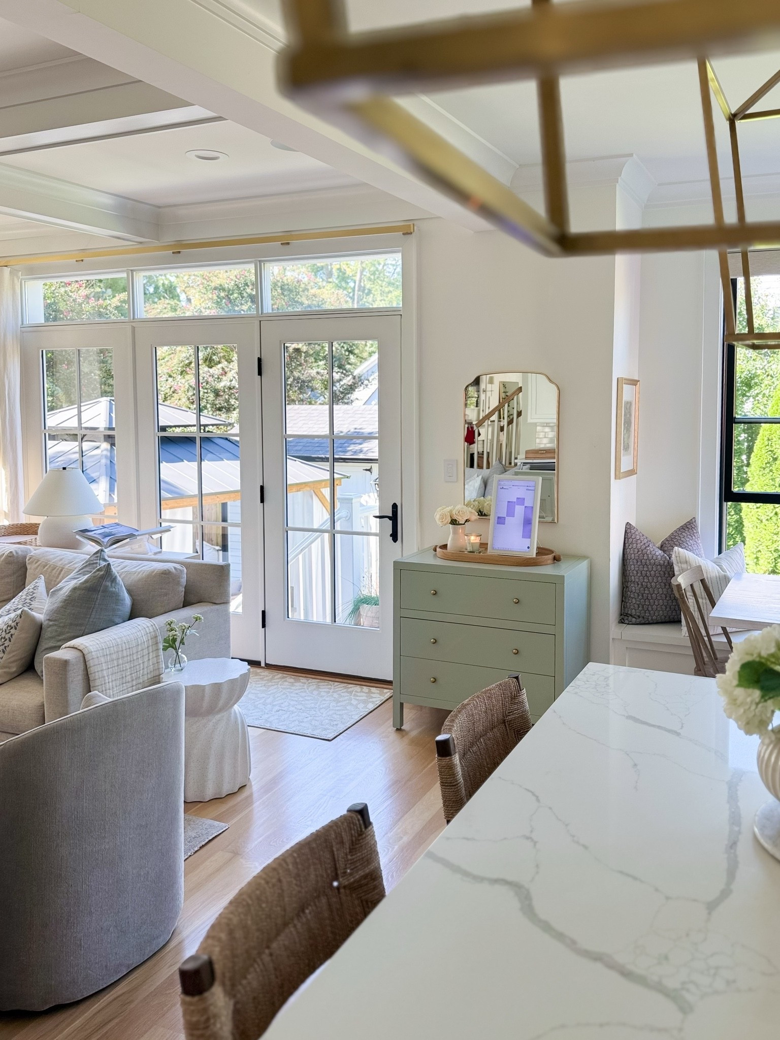 A little Nancy Meyers-inspired moment in our open-concept kitchen and breakfast nook. 🤍 I used this 3-drawer Celine dresser as a dining server, and it’s become one of my favorite functional pieces in our home. It gives me hidden storage for table linens, placemats, and entertaining essentials while adding that warm, collected furniture look I love in a kitchen.

Styled with fresh flowers, layered artwork, and timeless accessories, it makes our breakfast nook feel cozy and intentional while still flowing beautifully into the great room. Linking the Celine dresser and all of my favorite kitchen, breakfast nook, and open-concept living finds below.

#LTKHome #LTKSeasonal #LTKSaleAlert