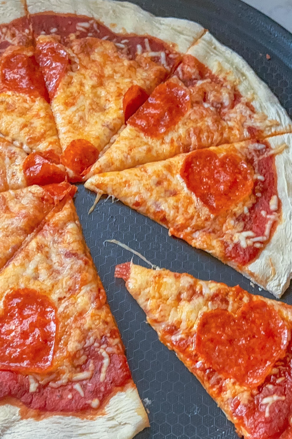 My kitchen just got an upgrade, and I needed to create something fun. Enter—this SWEETHEART PEPPERONI PIZZA! ❤️🍕 Thanks to the @hexclad Hybrid Pizza Steel, every slice has the perfect crispy crust. #gifted

Here’s how I made it:
I used store-bought pizza dough, rolled it out, and baked it on the pizza steel for 5 minutes at 400°F. Then, I added my toppings—sauce, mozzarella, and the cutest pepperoni hearts (just fold your pepperoni in half and cut out hearts with kitchen shears, just like you did as a kid!). Back in the oven for 15-20 minutes!

The @hexclad Hybrid Pizza Steel heats up fast and evenly with its tri-ply construction, making it perfect for pizzas up to 14”. Oven-safe to 900°F and even BBQ-friendly, this lightweight, two-handled design makes pizza night a breeze. Ready to fall in love with your crust? 💕

Do yourself a favor and grab yours at @hexclad and upgrade your pizza game!

#charcuterieandthings #hexcladcreator #homemadepizza #valentineday #pizzalover