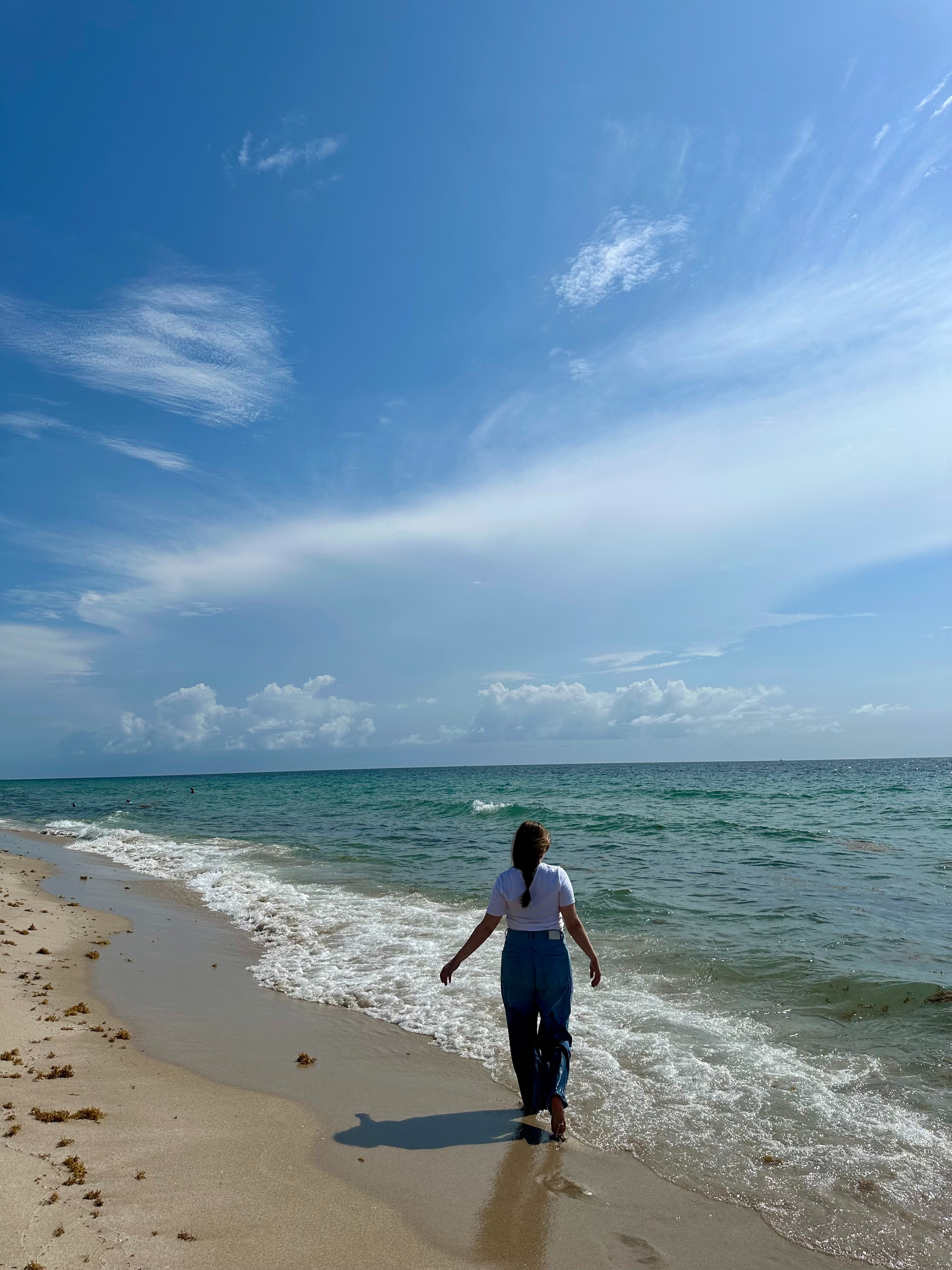 look how cute my sister is walking on the beach in a class white tee and wide jeans 

 #LTKSummerEdit