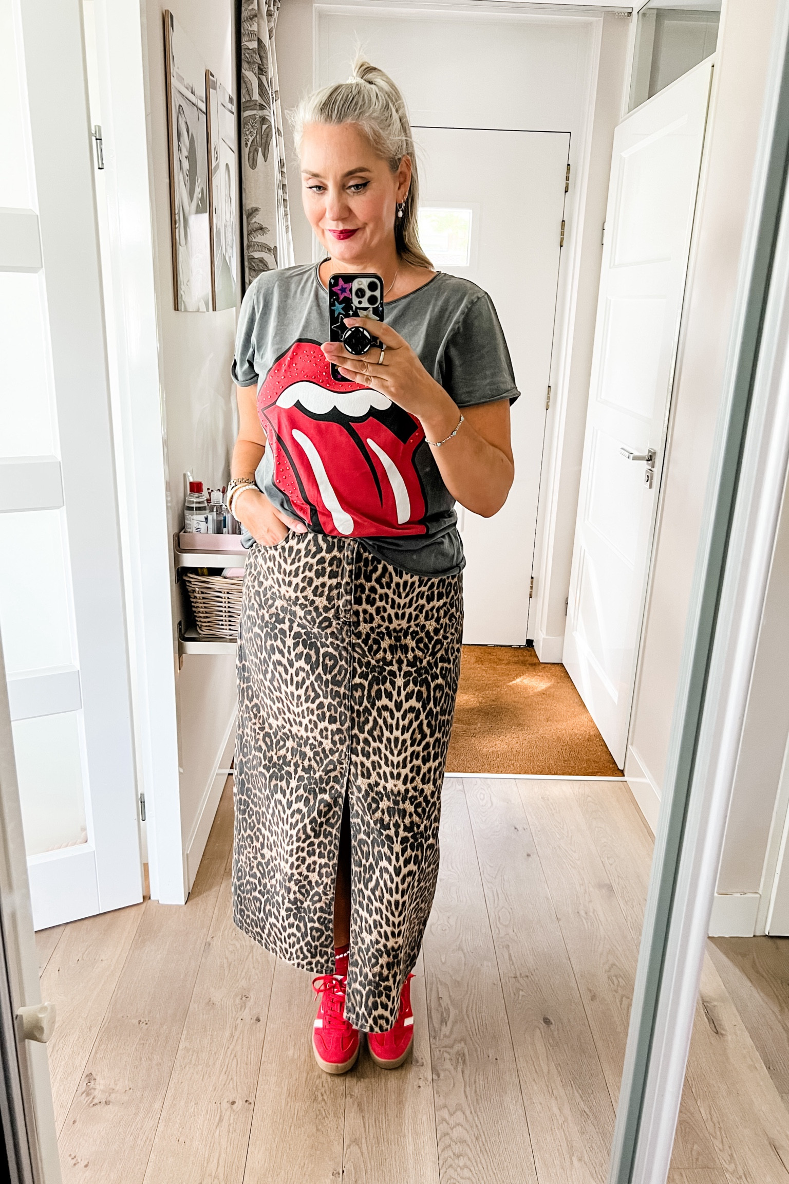 Ootd - Friday. An old Rolling Stones t-shirt paired with a leopard print denim maxi skirt (Neo Noir via Molly & My, discount code MW5), red socks and red retro sneakers. 

#LTKeurope #LTKnederlands #LTKsummer