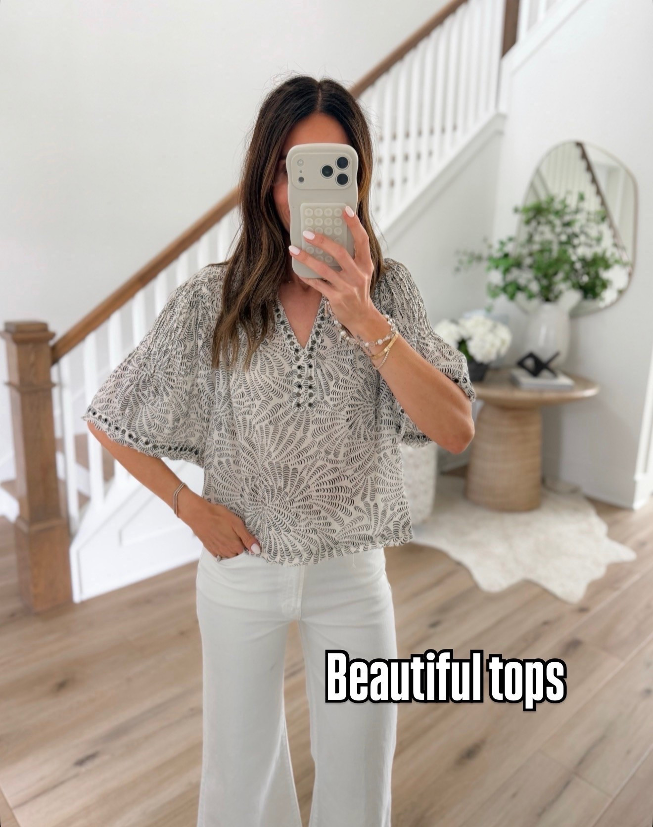 This top is so pretty and unique in person. The print gives it such an elevated boutique feel and I love how easy it is to pair with white denim for a chic summer look. Lightweight, flattering, and one of those tops that instantly makes an outfit look styled.

Printed blouse, boutique style top, chic summer outfit, white jeans outfit, elevated casual style, neutral fashion, feminine blouse, effortless outfit inspo, everyday chic, classy casual outfit, summer fashion finds, stylish tops, resort style, elevated basics, annabrstyle

#LTKOver40 #LTKSeasonal #LTKootd
