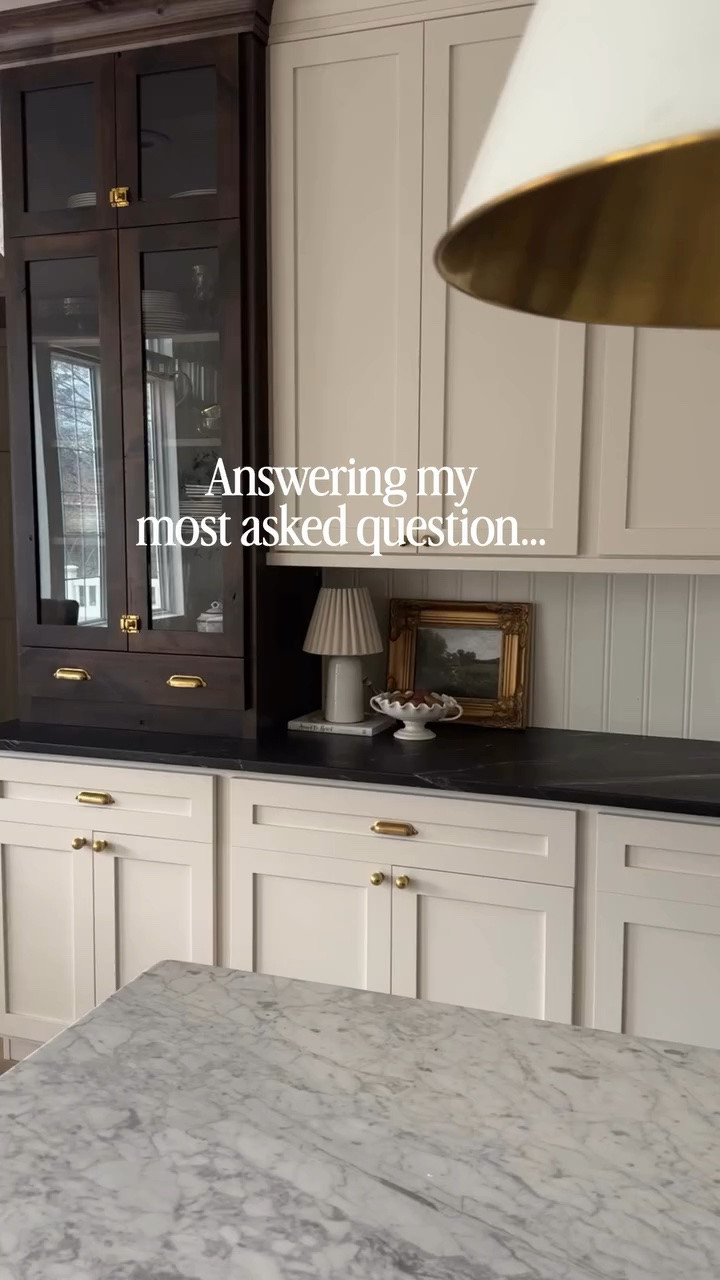 Answering my most asked question on my page… What is my kitchen cabinet color?? If you are searching for the most perfect neutral undertone cream, she is your girl! We had our living room arch built ins painted this color before we began our kitchen renovation and luckily I was in love with the color because I didn’t have time to get a real life sample! Beyond happy with this color and would choose it over and over again!  Follow along @ourmountainsidehome_1 🤎. Kitchen, kitchen cabinets, kitchen renovation, cream paint color, neutral kitchen, warm neutral kitchen, Ralph Lauren inspired home, Nancy Meyers home aesthetic, cozy vibes, collected home.  #kitchen #kitcheninspiration #neutralkitchen #nancymeyersaesthetic #ralphlaurenhome