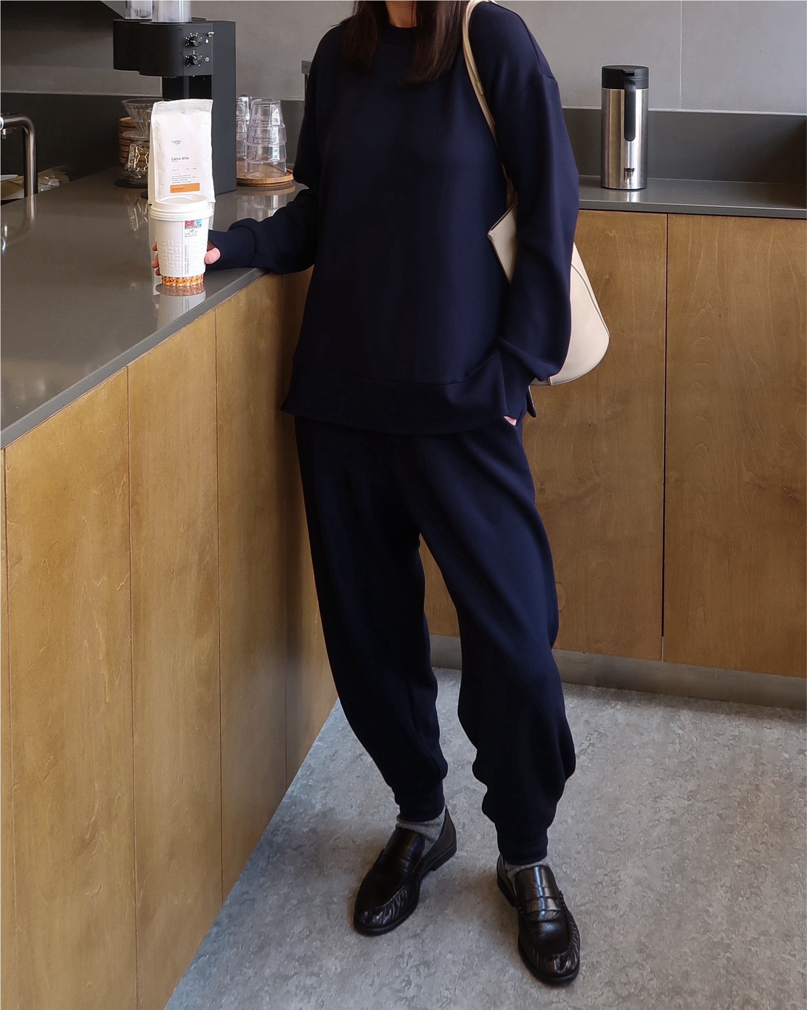 Minimal and cosy outfit for the morning coffee run ☕️

Women fashion, outfit inspiration, monochromatic outfit, navy blue oversized sweatshirt, relaxed-fit joggers, leather loafers, grey socks, beige shoulder bag, coffee shop interior, relaxed, effortlessly stylish, focus on comfort, understated elegance

#LTKwinter #LTKeurope #LTKstyletip