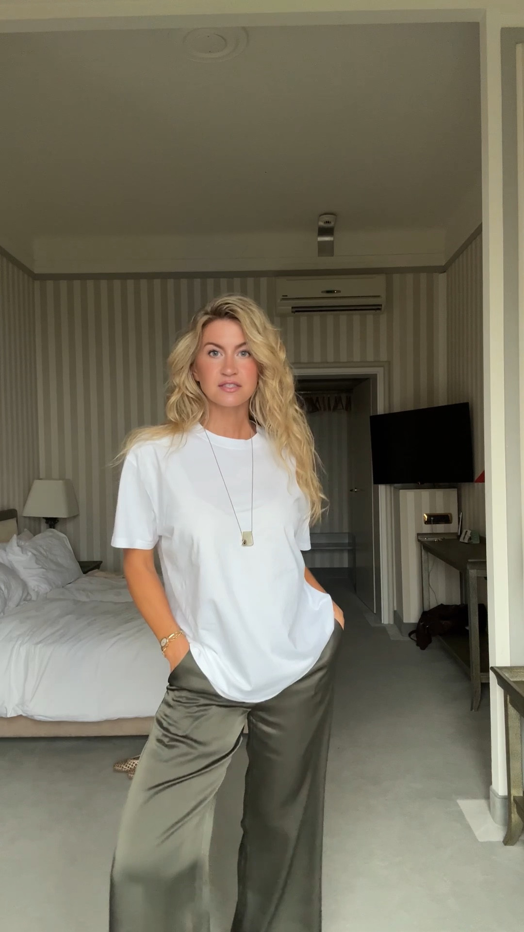 Comfy casual outfit for staying in. 
Green satin pants: run TTS, wearing a S
White oversized tee: runs large, wearing a S - sold out but linked to very similar option I love. 
Gold woven flats: runs TTS 
Long silver necklace with tigers eye stone  

#LTKStyleTip #LTKSeasonal #LTKTravel