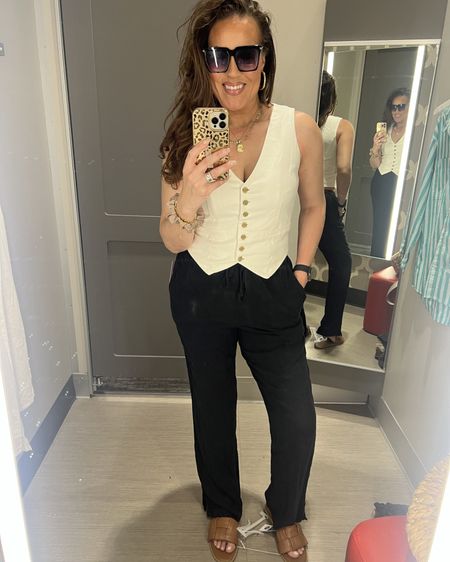 Target haul! Love these linen pants (they’re long enough even for me at 5’10”) so much I got them in off white and black! I love a black and white moment. Perfect styled for date night, work wear, brunch and of course poolside and vacay. This off white vest is great to wear pair with these linen pants for happy hour, date night or on vacay. Love these chic sandals I got in ‘Cognac’. They come in a cream color too. I also linked another cute designer inspired black pair I got which I would wear with this black and white outfit. How fun is this handbag for Spring and Summer? Target style, Spring outfit, Summer outfit, #LaidbackLuxeLife

Vest: S
Pants: M
Sandals: Run TTS

Follow me for more fashion finds, beauty faves, lifestyle, home decor, sales and more! So glad you’re here!! XO, Karma

#LTKfindsunder50 #LTKSeasonal #LTKstyletip
