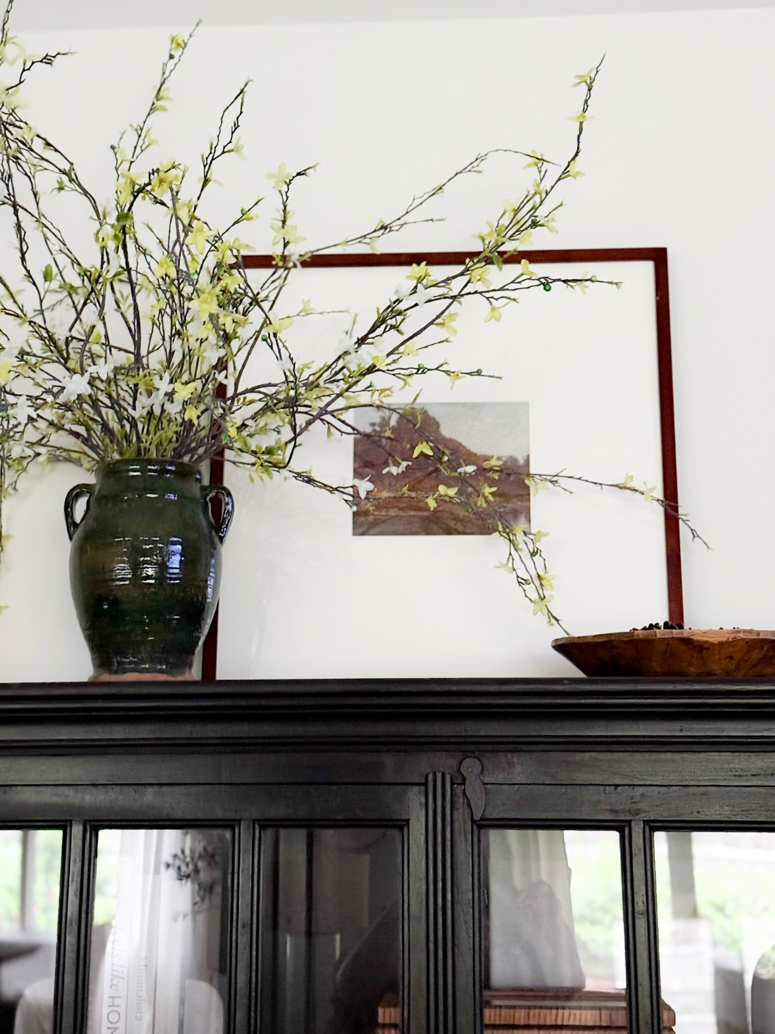 Floral stems, large statement branches, rustic vase, top of cabinet styling, console styling 

#LTKStyleTip #LTKHome