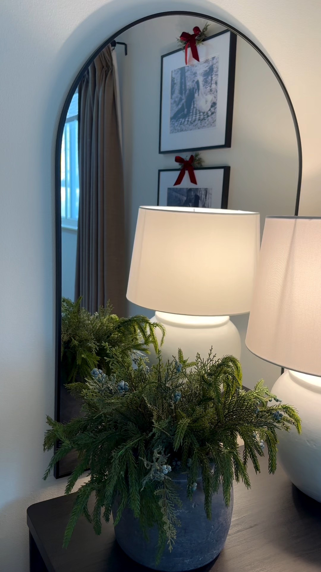 Arch mirror, mirror above nightstand, black nightstand, Norfolk pine, mirror, bedroom, bedroom styling 

#LTKHome #LTKHoliday #LTKSeasonal