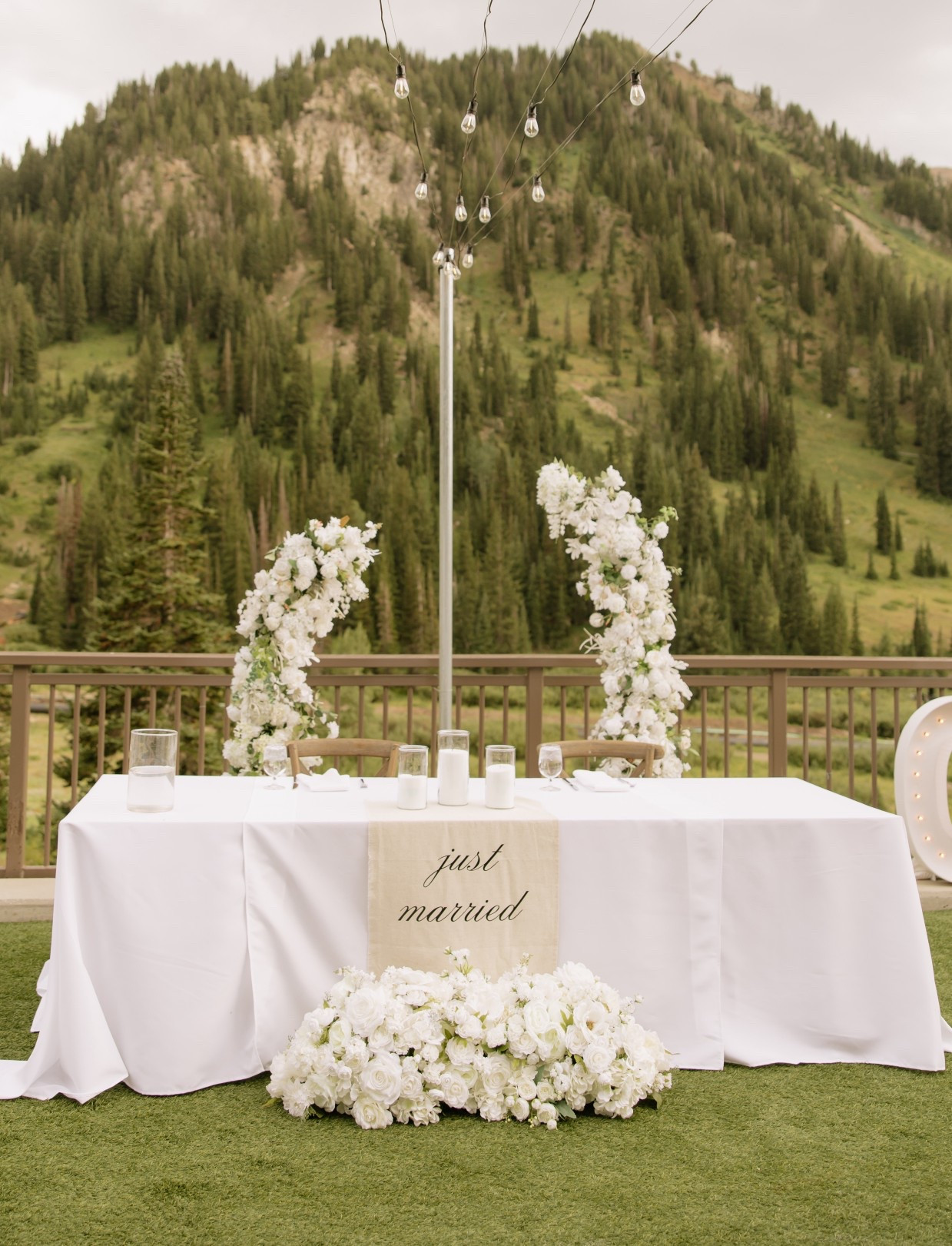 Sweetheart table with linen sign and white florals

#LTKWedding