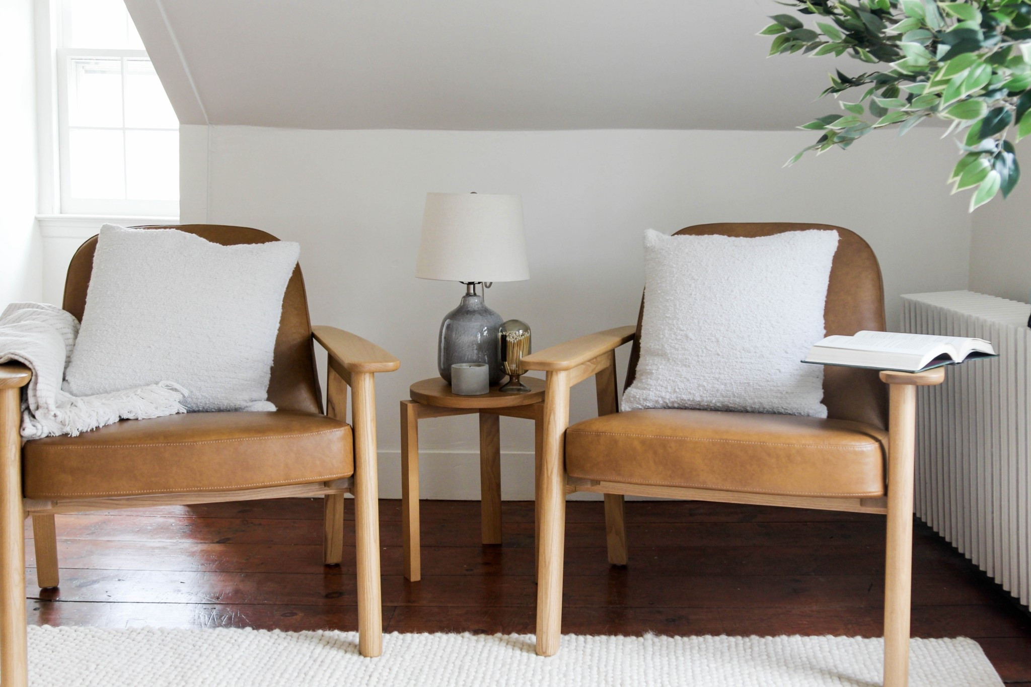 Leather chairs paired with simple wood and soft textures in this seating area. 

#LTKHome #LTKSaleAlert