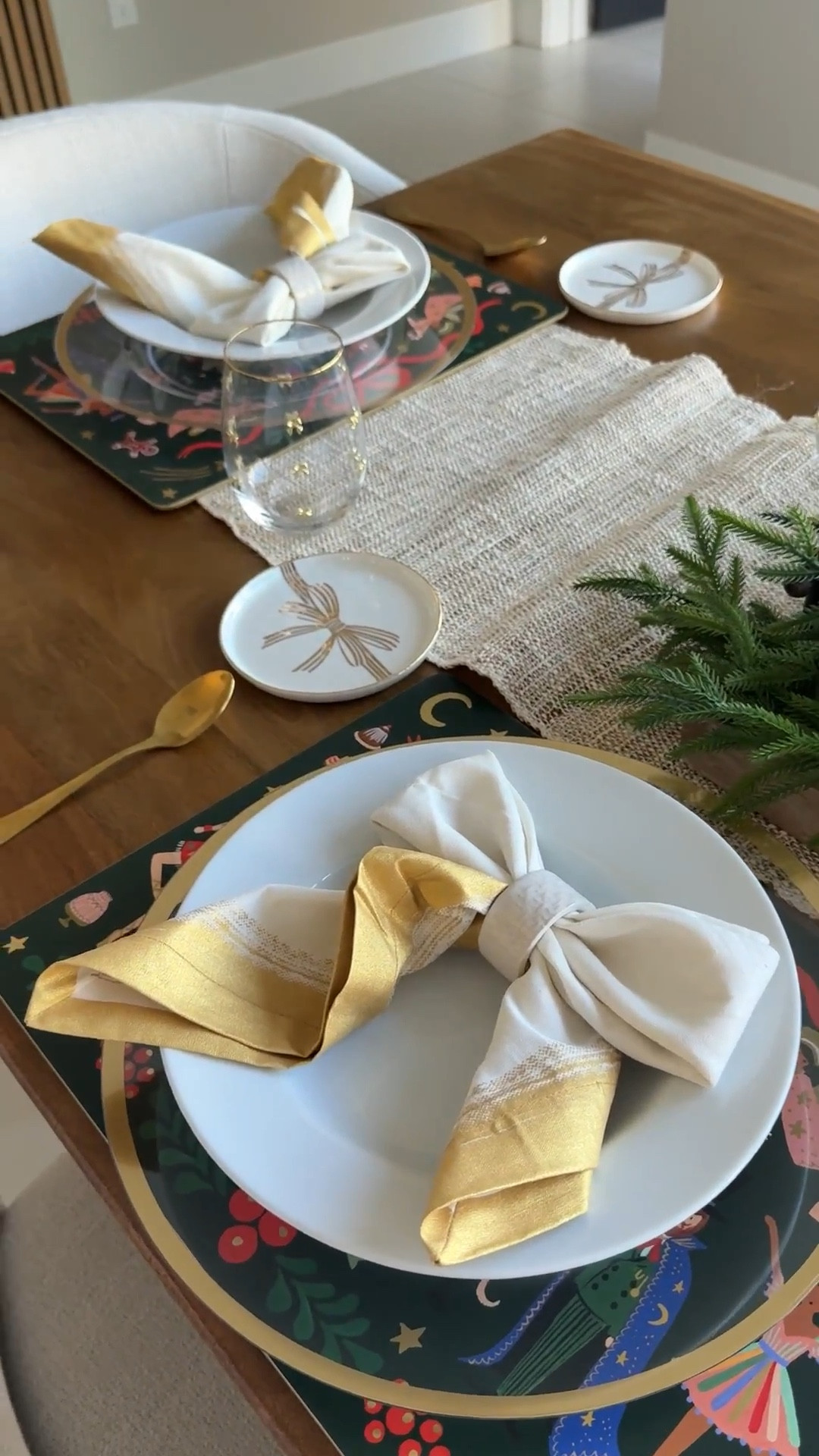 Holiday dining table with bow plates and napkins 

#LTKHoliday #LTKHome