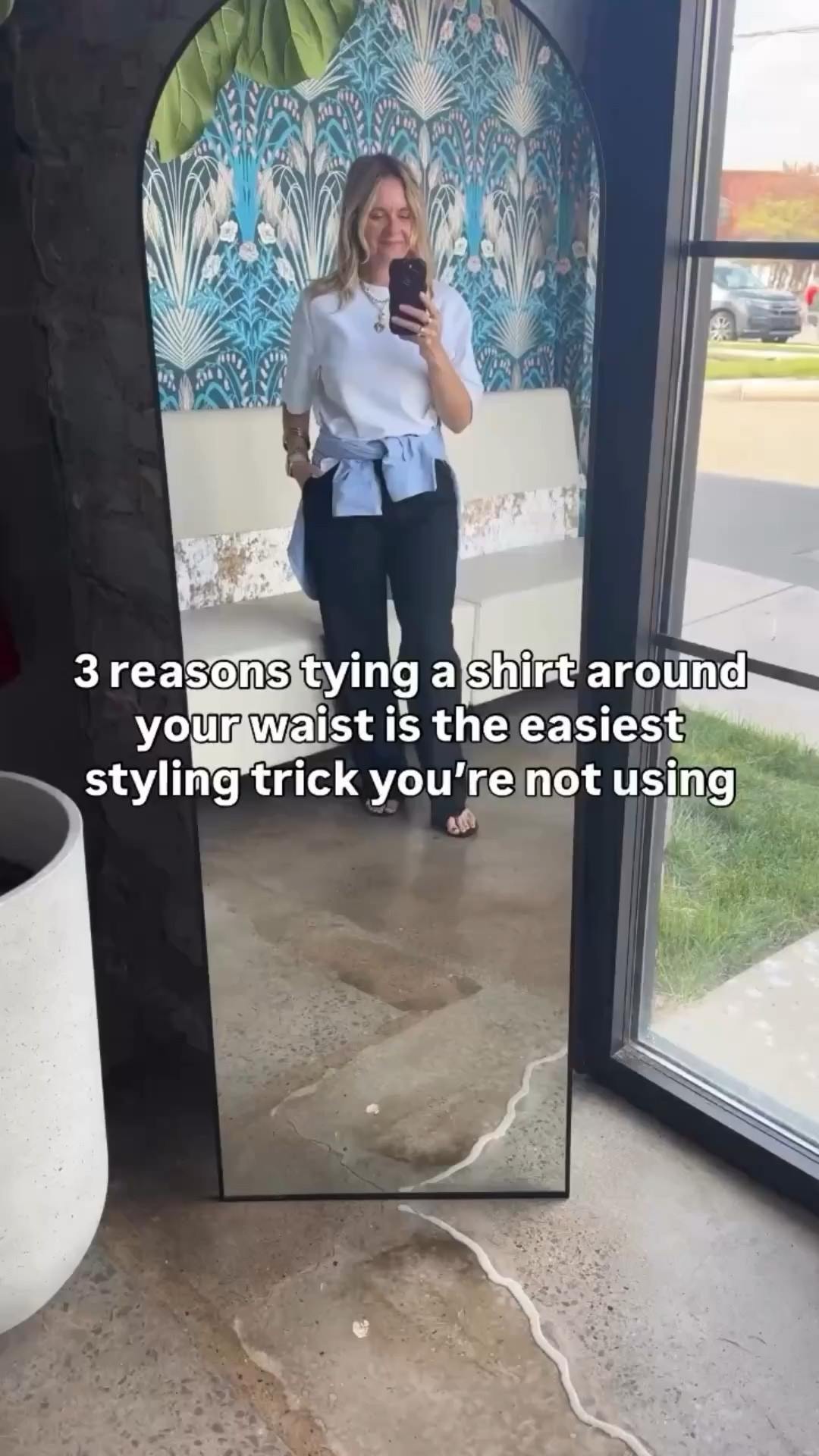Here are 3 reasons tying a shirt around your waist is the easiest styling trick you’re not using 👇

📍It defines your waist without a belt. The knot sits right at the hip and creates shape naturally — no extra accessories required.

📍It adds a layer of color or texture without adding bulk. A light blue oxford over black trousers instantly breaks up a basic palette and makes the outfit feel intentional rather than thrown together.

📍It gives you a built-in backup. Too cold inside? Untie it and throw it on. Too warm outside? Tie it back. It’s the most functional styling trick in the book.

OOTD for a day at the office ✨ White tee + black trousers + light blue oxford tied at the waist + black flip flops + gold jewelry. Simple pieces, one small styling move, completely different outfit. Everything linked below! 👇

Comment SHOP below to receive a DM with the link to this post on our LTK ⬇ https://liketk.it/64akw #ltkover40 #ltkootd #ltkgrwm