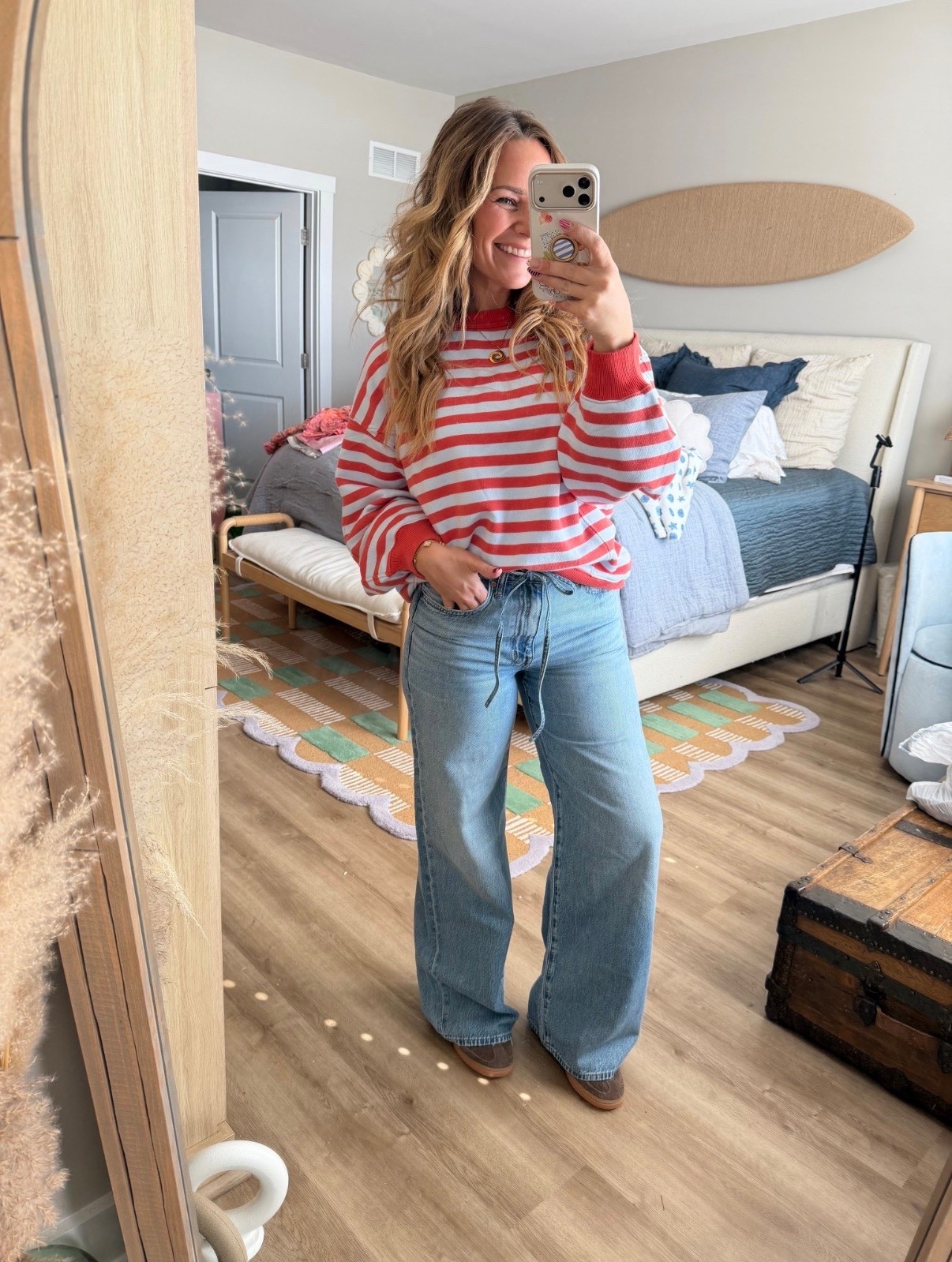 Easy everyday outfit but make it cute ❤️🤍 This red striped sweater is giving cozy + classic, and I paired it with my favorite high-rise wide leg jeans for that effortless, throw-on-and-go vibe. Perfect for school drop-off, coffee runs, or casual weekend plans. Comfy, flattering, and such a staple combo!

red striped sweater, striped pullover, cozy sweater outfit, casual everyday look, high rise wide leg jeans, wide leg denim, relaxed fit jeans, mom style outfit, effortless style, casual chic, fall outfit idea, spring transition outfit, comfy cute outfit, coffee run look, teacher outfit inspo, classic stripes, capsule wardrobe staples, neutral casual outfit