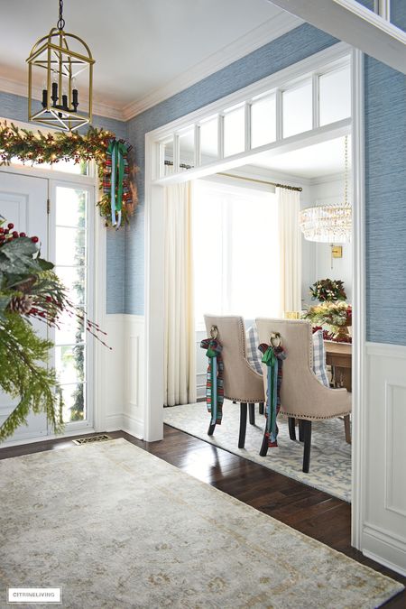 Blue faux grasscloth in our entryway is a chic way to greet guests! I love the blue with all our holiday greenery!!

#LTKhome #LTKstyletip