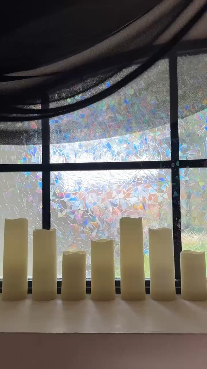 Halloween decor that is simple and goes with any aesthetic! These flameless candles are great because they can go in hard to reach places and turn on with the click of a button! PS: I added that window cling as well!  

 #LTKHalloween #LTKHome #LTKFamily