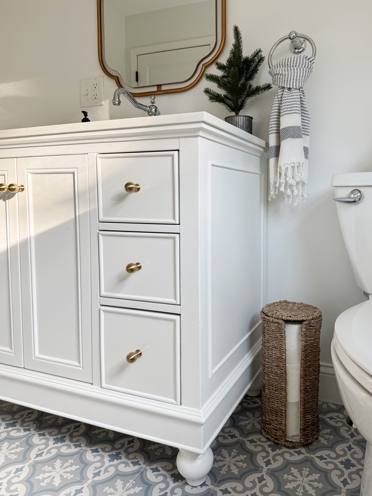 Coastal Half Bath

light and airy bathroom, coastal bathroom, gold mirror, gold and white vanity, blue vase, gold and white vanity light, sherri calnan home 

#LTKHoliday #LTKHome
