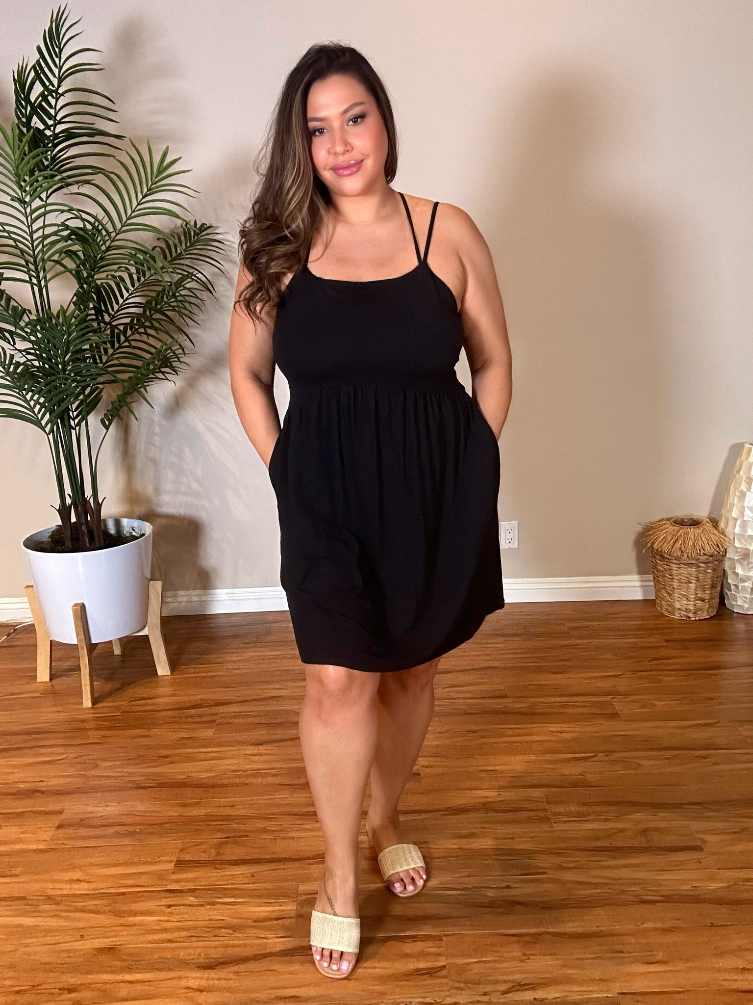 Simple criss cross black dress… bonus it has pockets. Soft and easy for every day errands. Pair with sandals or sneakers for a sporty look. Can be worn into night with a strappy heel to match the strappy back. 