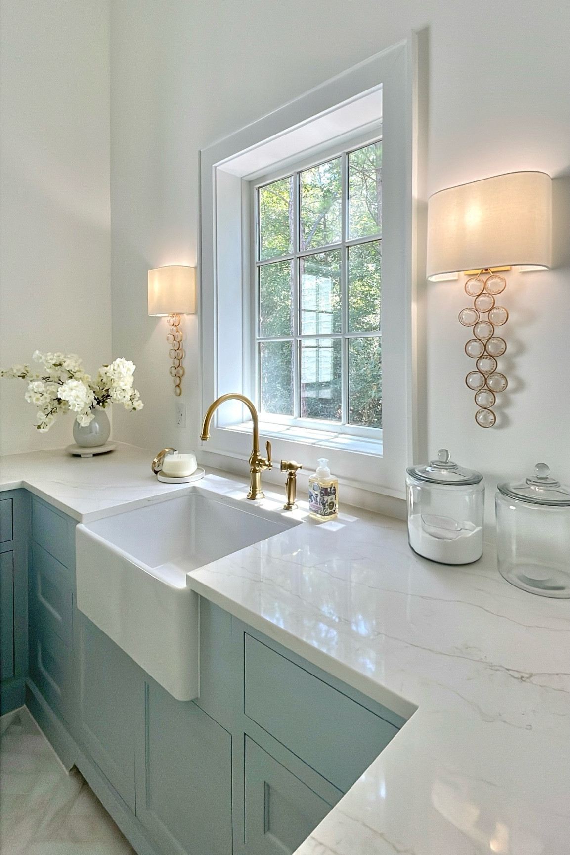 Utility room, laundry room, home decor
Glass canisters, brass faucet, wall sconces, candle


#LTKhome