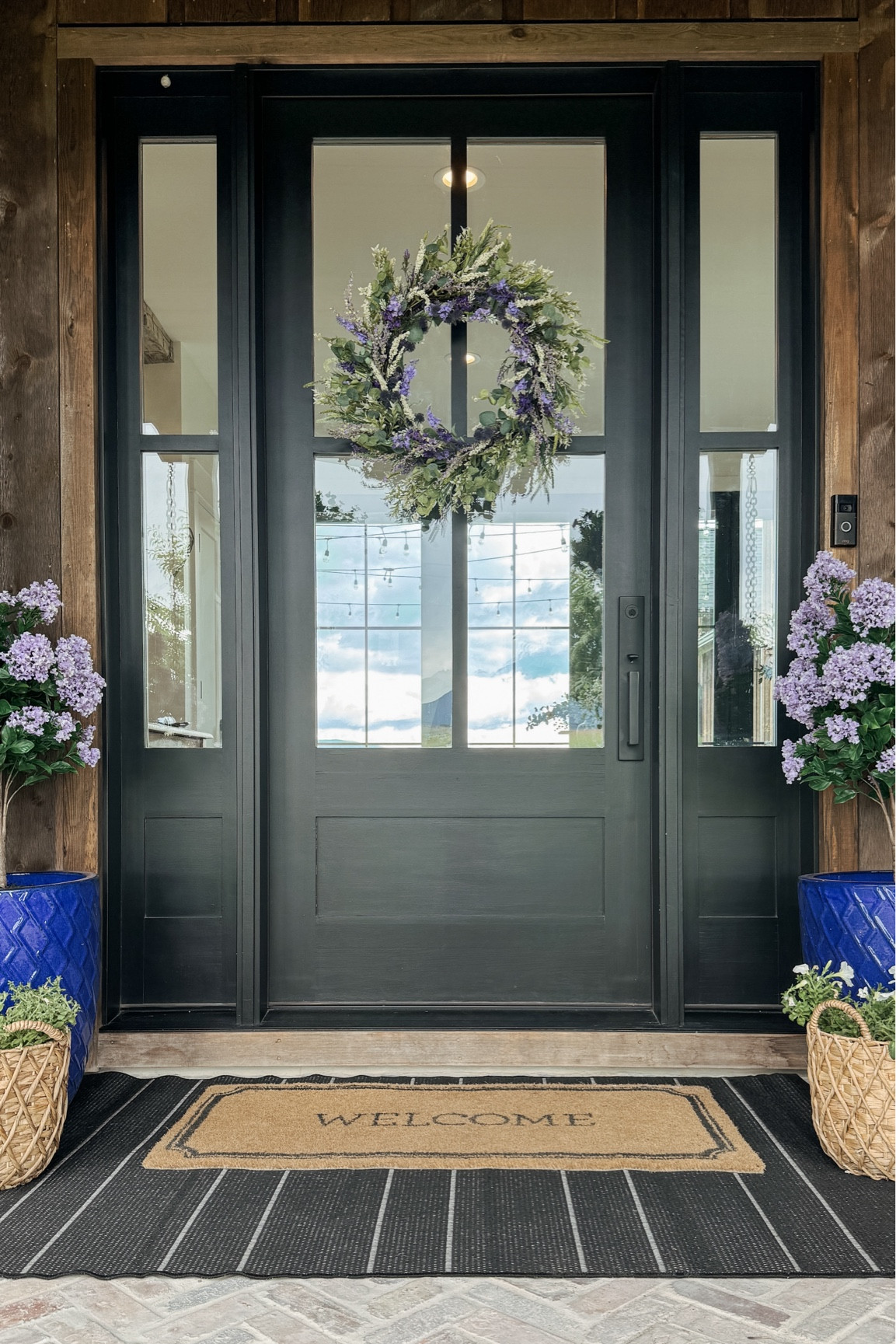 Let’s put this front porch together! I absolutely love these flowers that we chose and this wreath is beyond stunning!

Landscaping, flowers, summer wreath, lilac trees, basket planter, hanging baskets

#LTKVideo #LTKHome