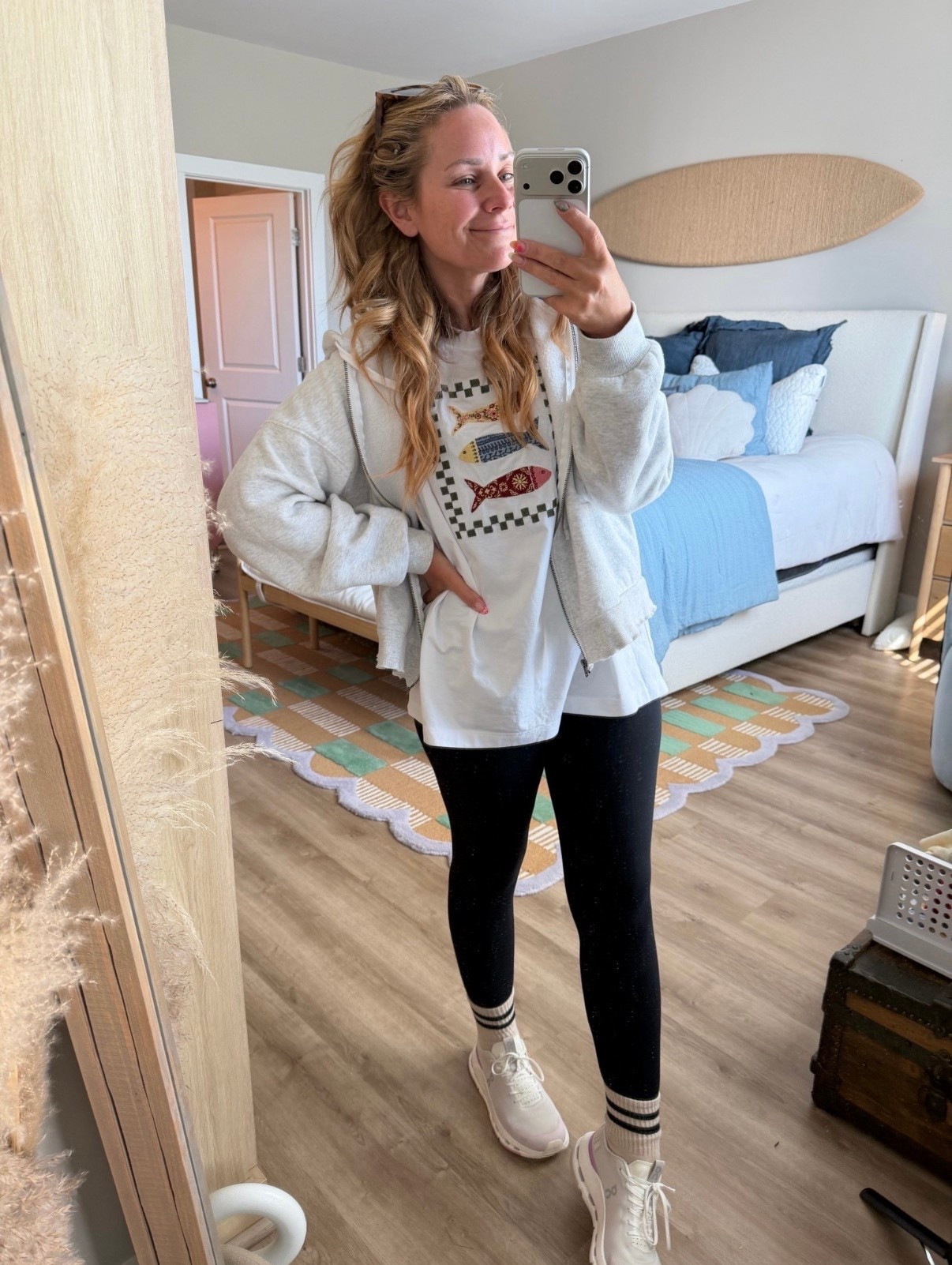 Effortless everyday outfit you’ll reach for on repeat 🤍

Soft zip-up hoodie + graphic tee + classic black leggings = the easiest throw-on-and-go combo that still looks put together. Perfect for school drop-offs, errands, or weekend lounging—but make it cute.

Linked all the comfy staples (and my go-to sneakers!) ✨
#ltkstyle #ltkunder100 #casualoutfits #momstyle #everydaystyle #athleisurelook