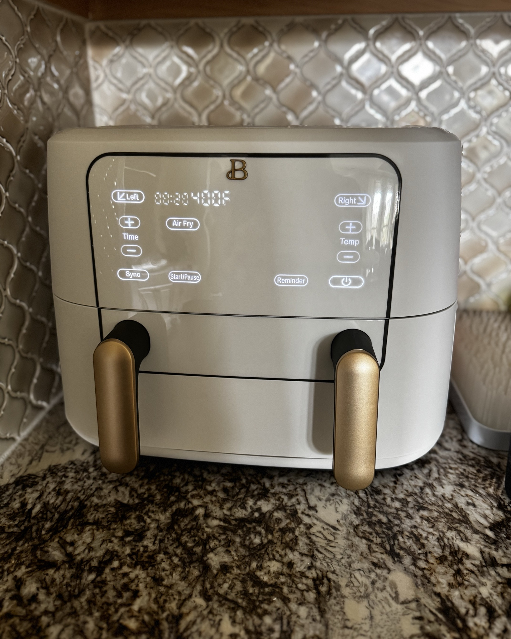 Low key obsessed with my new Drew Barrymore air fryer. The white and gold goes great in my kitchen. It has two sides so you can cook two different things at the same time. There is also a sync button that will make the two sides finish at the same time.

The white one (pictured here) is on sale at Walmart for $68 right now!
