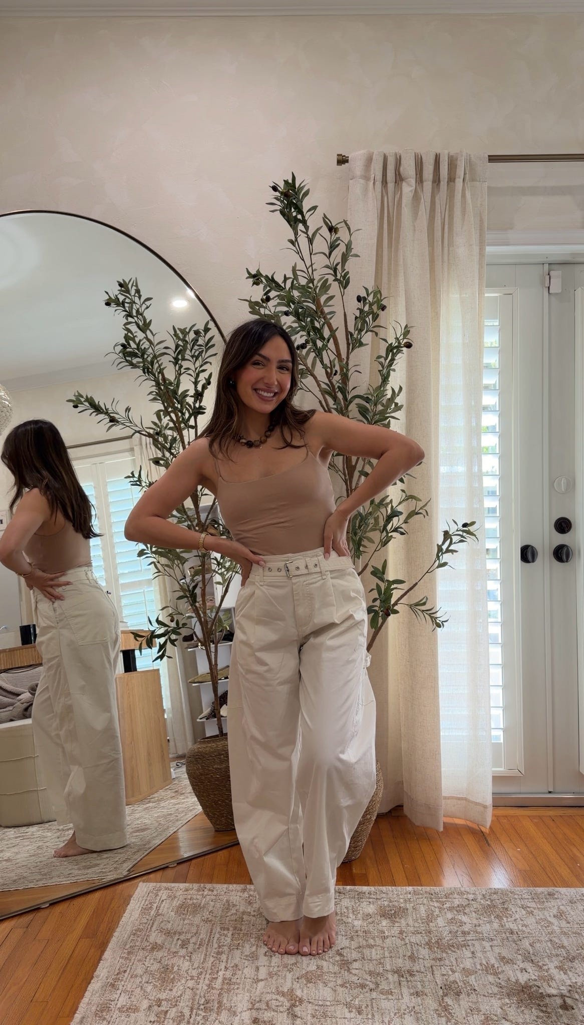 These pants are seriously the coolest fit!!! The barrel shape makes them feel really elevated and the belt detail is SO good. I love pairing them with a simple tank for an easy neutral look. 25% off with code AFLTK. 

#LTKSpringSale #LTKSaleAlert #LTKPetite