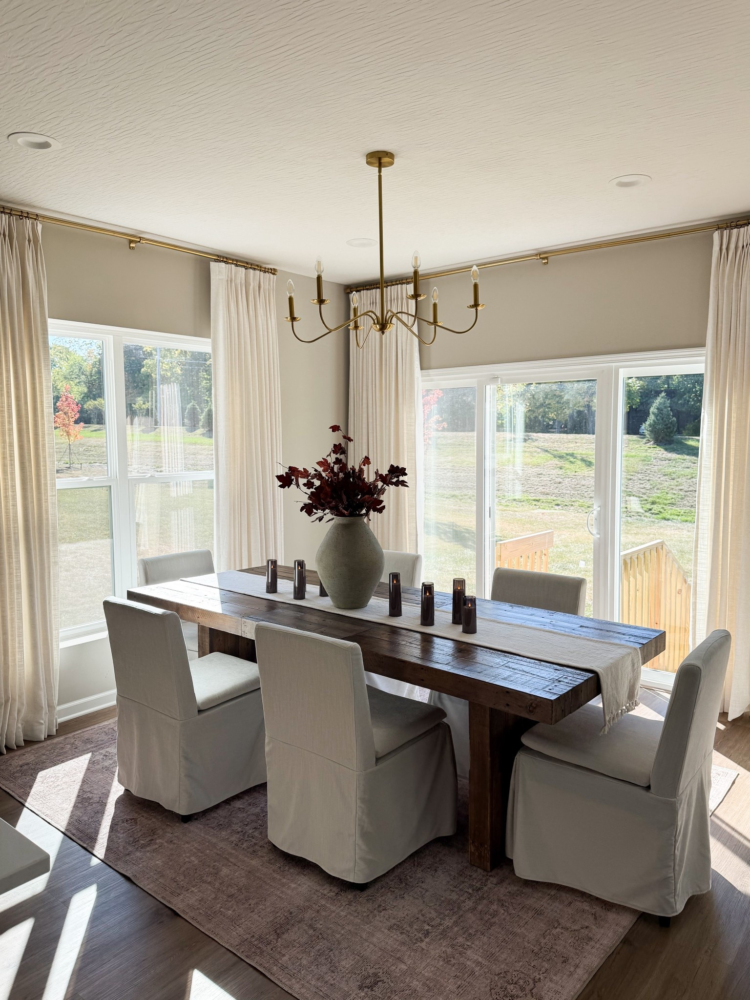 Affordable custom curtains for living room & dining room. Dining room decor, custom curtains, dining chairs, dining table. 
My exact Curtains measurements: Header: Double Pleat 
Color: Ivory 
Length: 105" per panel
Width: 75" per panel for right window 
Width: 55" per panel for left window 

#LTKHome #LTKSeasonal
