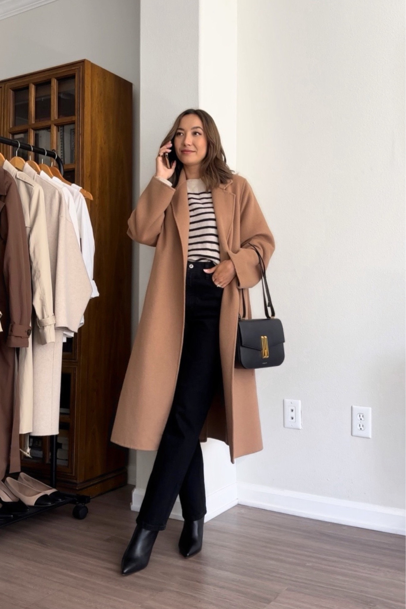 Classic fall outfit info styling a camel coat

- Fall style / classic style / camel coat / striped sweater / black jeans / black booties / black heel boots / black purse 

#LTKSeasonal #LTKstyletip