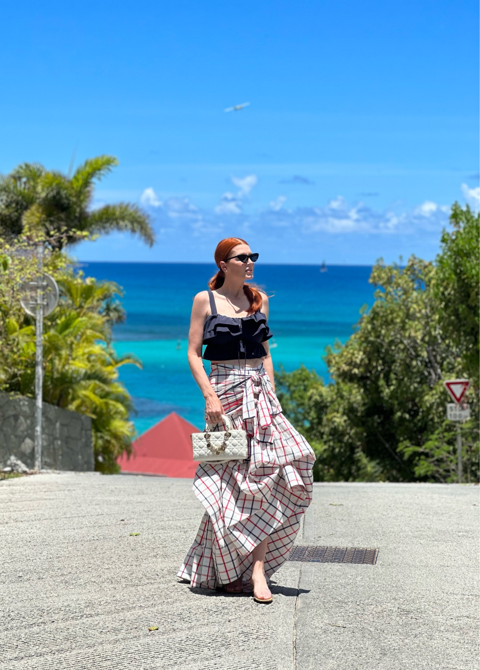 We went to a super glam lunch in St. Barths and I wore another one of my favorites from Rosie Assoulin. I pinned it up to hide the train (since it felt a little too formal that way for a brunch). 
I wear these lucite mules constantly and if I only had one pair of those on this trip, this would have been it. 
