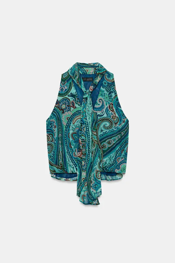 Model height: 183 cmTop featuring a collar with a tied detail, V-neckline and sleeveless design. ... | Zara UK