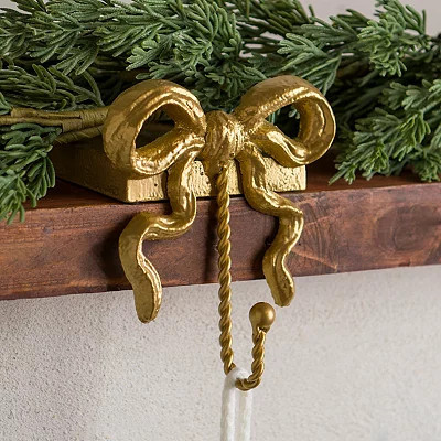 Bow Christmas Stocking Holder, Gold, 4.53L x 5.12W 5.43H , Metal/Rope | Kirkland's Home | Kirklands