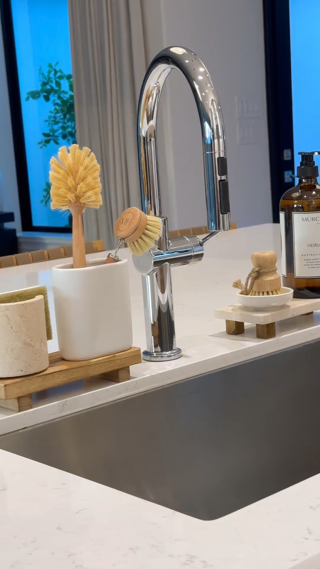 Kitchen Sink Essentials: 

Wooden & travertine risers 
Dish sponge holder 
Brush holders
Glass, pot, and dish brushes
Dish soap 


#LTKSaleAlert #LTKStyleTip #LTKHome