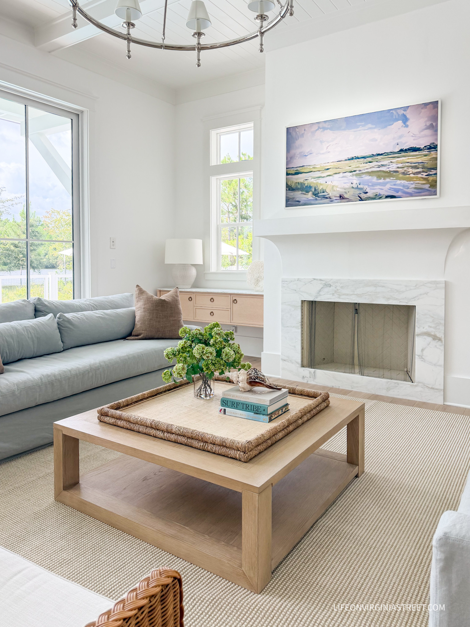 A peek at our new living room with our light blue sofas (Seaglass Performance Rustic Linen), woven swivel chairs, and light wood coffee table.

#LTKHome #LTKSaleAlert #LTKSeasonal #LTKSeasonal #LTKHome #LTKSaleAlert