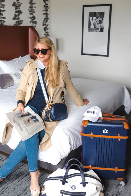 Travel style from the weekend. Linking this navy luggage, Weekender bag, trench coat, navy leather crossbody bag, striped bag straps, navy collared sweater, blue jeans in tall sizing, and brown leather flats. 

#luggage #travel bag #ladiestrenchcoat #womenstrenchcoat #canvasweekenderbag #markandgraham #preppy #brooksbrothers #anntaylor #tuckernuck

#LTKFind #LTKSeasonal #LTKtravel