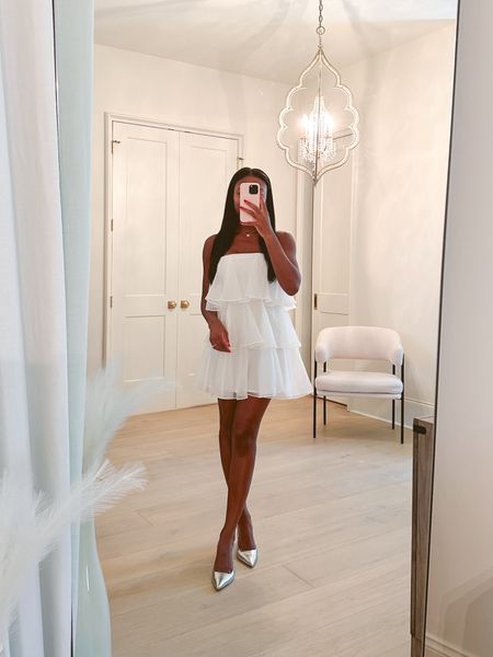 Obsessed with this white tiered strapless mini dress! Absolutely stunning in person—comes with straps and in several other colors! It would be perfect for a bachelorette party or rehearsal dinner! Wearing an xs! ✨

Rehearsal dinner dress, white dress, bachelorette dress, tiered dress, ruffle dress, spring dress, summer dress, mini dress, bride-to-be, silver heels 

#LTKfindsunder100 #LTKwedding #LTKshoecrush