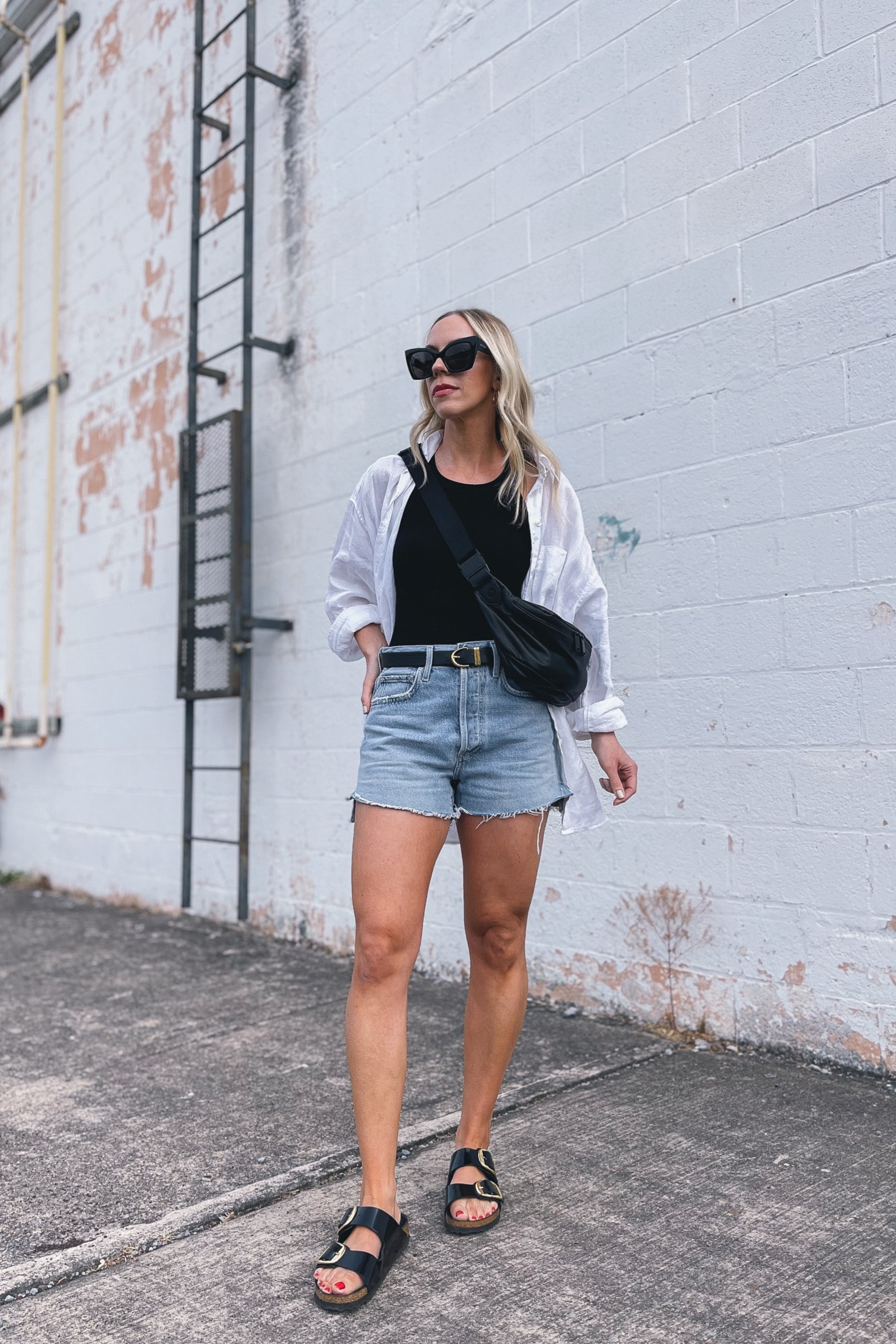Casual summer outfit, linen button down shirt, cutoff denim shorts, black and white summer outfit, big buckle Birkenstock sandals, leather sling bag

#LTKunder50 #LTKshoecrush #LTKitbag