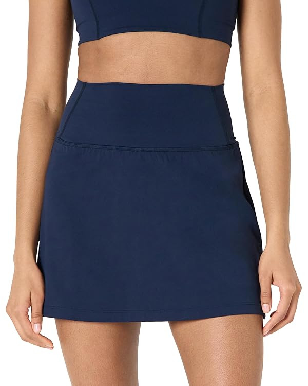 Amazon Essentials Women's Active Formflex Buttery Soft Tennis Skirt with Built-in Shorts with Poc... | Amazon (US)