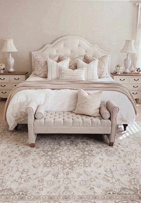 Layers of warm neutrals in the bedroom keep it calm and cozy