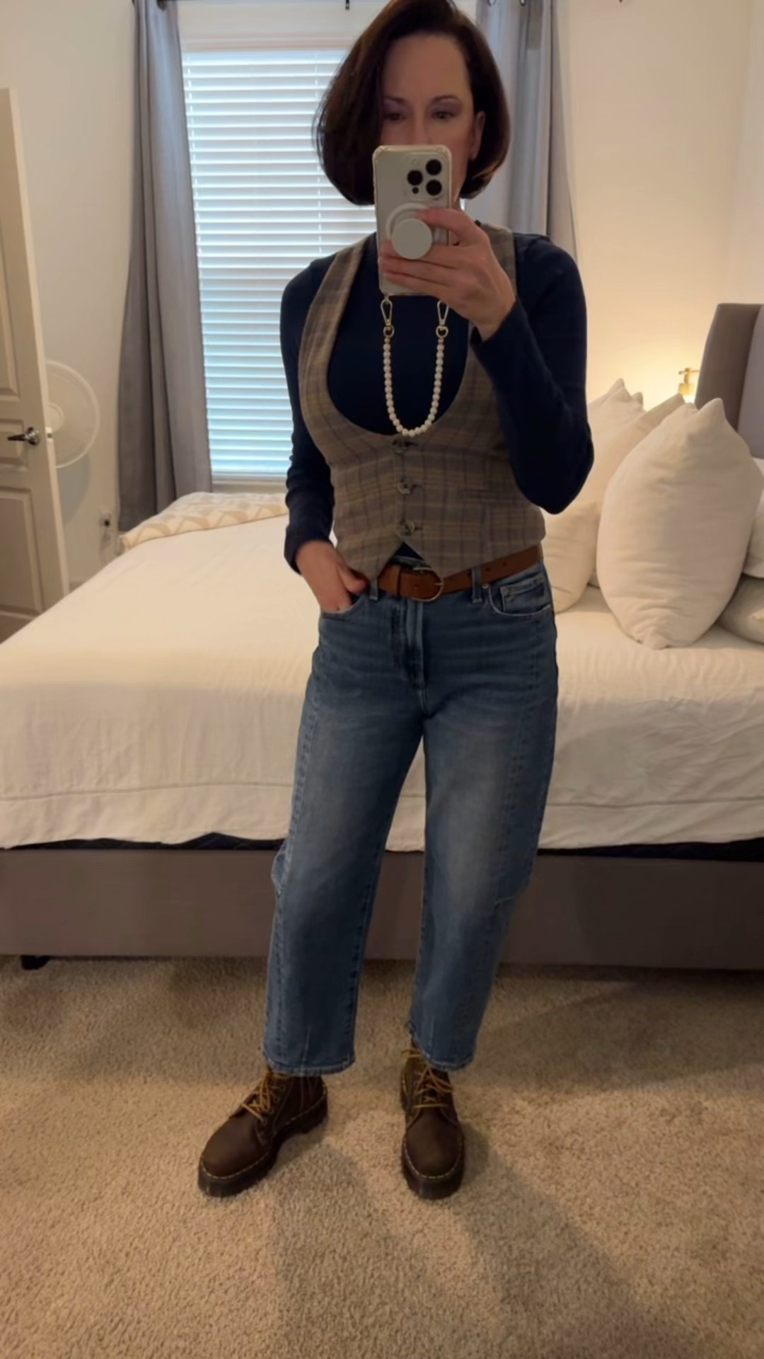 Barrel jeans. Vest. Long sleeve T-shirt. Combat boots. 

#LTKgrwm #LTKOver40 #LTKMidsize