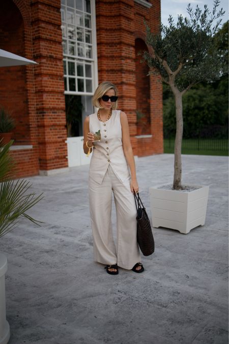 Summer garden party or summer holiday outfit. Linen co-ord, leather woven basket bag, linen waistcoat, gold shell earrings 

#LTKsummer #LTKuk #LTKeurope