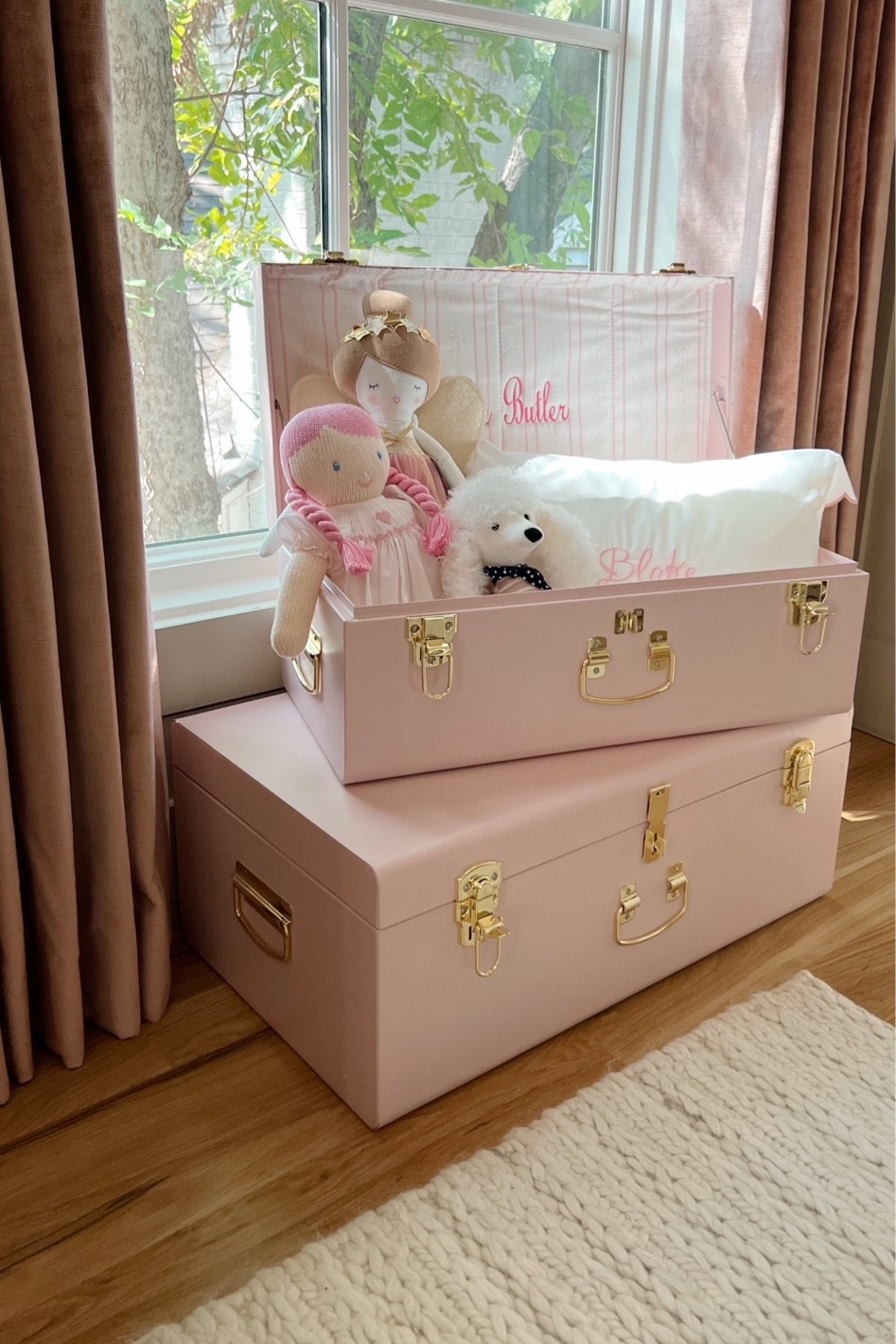 Petit keep trunks in baby girl nursery 