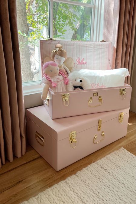 Petit keep trunks in baby girl nursery 