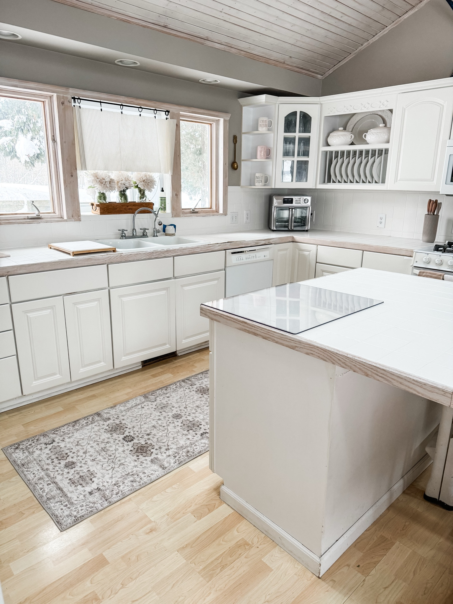 Last January, I completed a neutral kitchen refresh of my 24 year old kitchen Previously, these countertops were  French country blue and white tile. I used a tile paint to paint them white. And one year later, they are still pristinely white with only a few minor scrapes that need touching up. I added a few other pieces here from Amazon and I still love my neutral kitchen refresh a year later.

#LTKSeasonal #LTKHome #LTKFindsUnder100
