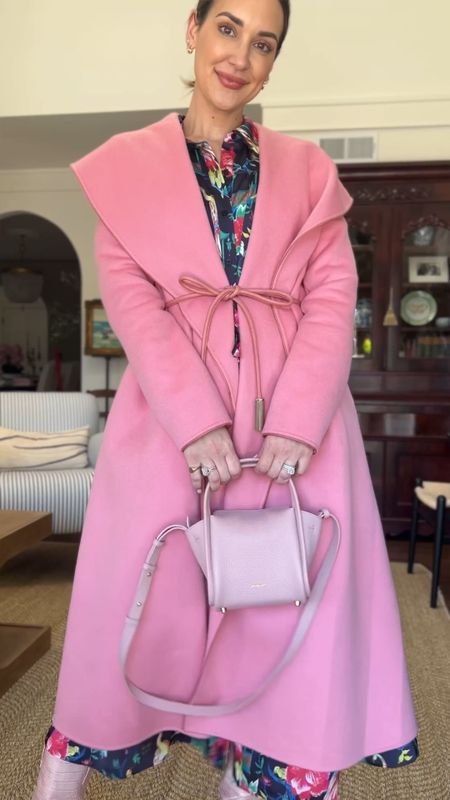Pink coat, belted dress, pink leather boots, pink crossbody bag