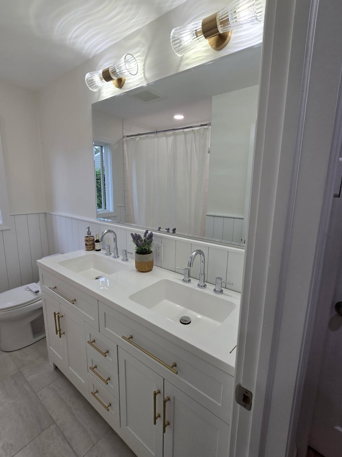 Absolutely in love with the way my new bathroom came out! I love the two tone metal look with chrome fixtures for the faucets, as well as shower and accessories, with gold handles for the vanity to match the most stunning gold lights! Everything is from Amazon, with the exception of my exact vanity and faucets that were from Lowe’s, however, I have found something very similar on Amazon and I’ve linked that below. My mirror is 55 x35 inches with lights installed above to fit with my 60 inch vanity. Tile floor was from a local distributor, half wall of shiplap was installed by my handyman, and the top wall is Benjamin Moore, Swiss coffee paint! HAPPY REMODELING 🙃🛁✨ #bathroom #remodel #bathroomupdates #bathroominspo

#LTKHome