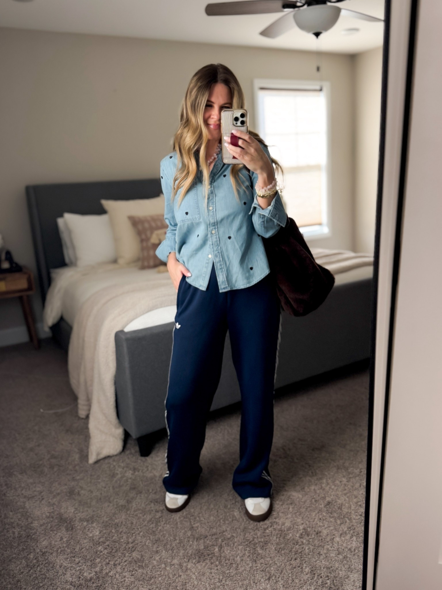 Soccer Sunday outfit of the day. I love a comfy track pant for the long car rides. I’m wearing a small in these. Paired with a denim shirt to make it elevated. Also wearing a small. Both fit true to size. 

#LTKOver40 #LTKmomlife #LTKootd