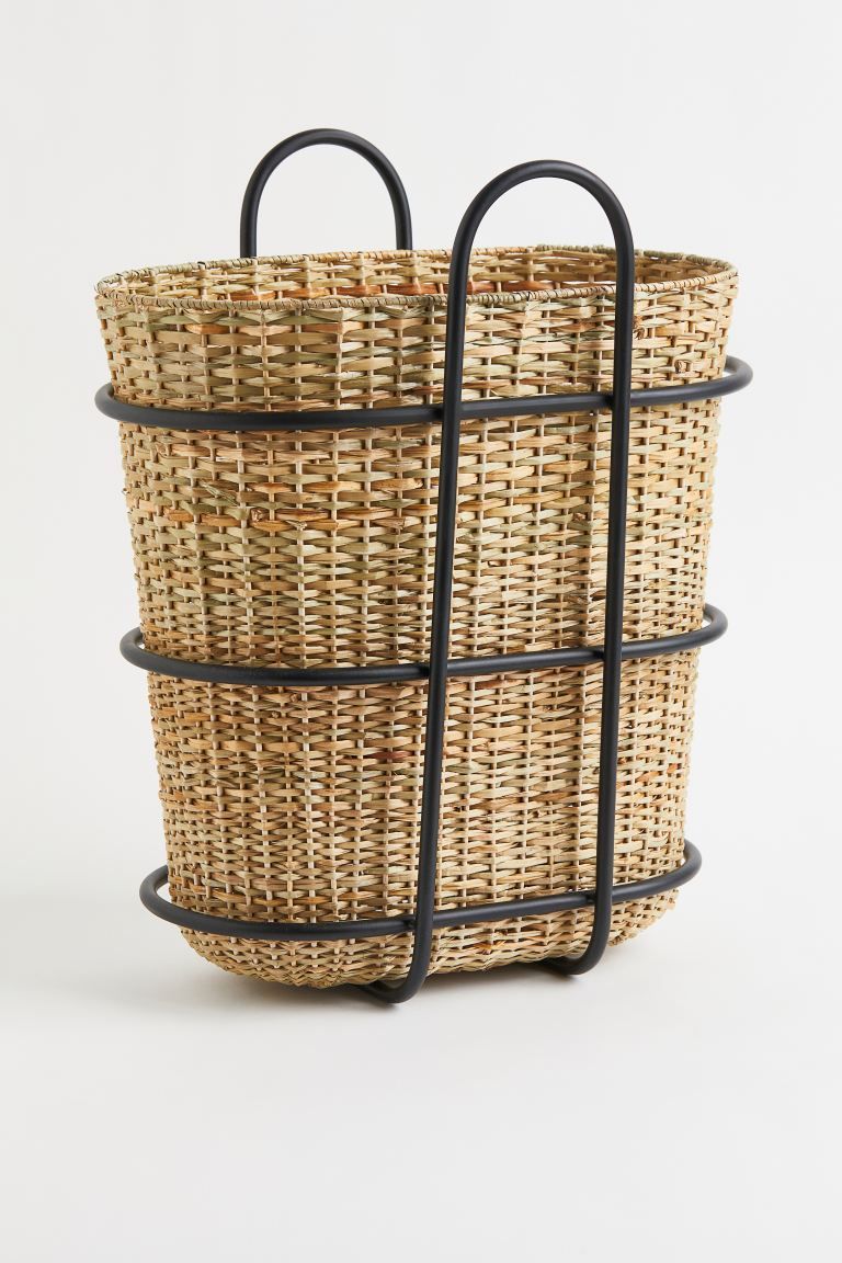 New ArrivalTall storage basket in braided seagrass with a metal frame. The basket has handles at ... | H&M (US + CA)