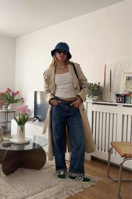 Simple spring outfit - & other stories trench coat, Uniqlo baggy jeans, topshop white vest top, adidas gazelles and denim bucket hat 

Tench - size 38
Jeans - w24 L31
Top - xs 

#LTKstyletip #LTKeurope