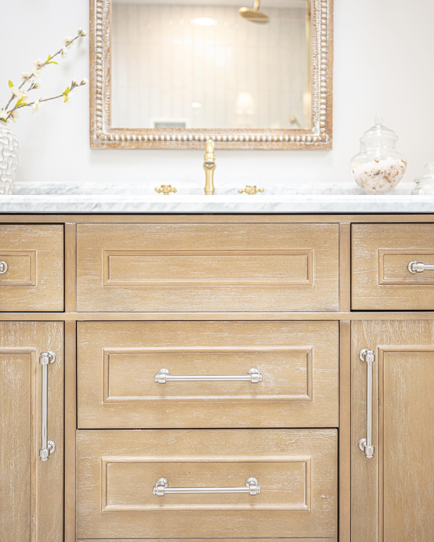 ✨Warm Wood + Marble, Yes Please! 🤩 Here’s the scoop on one of my favorite bathroom finds! 

Want the link to this beauty?👇🏼 (It comes in different sizes, too!)

Comment: VANITY below and I’ll send it your way! 🌟 But first, make sure you’re following, or the message might not make it through! 🚨

It’s all about finding those hidden gems that bring warmth and character to your space, no matter your style — This vanity blends seamlessly, offering both classic charm and timeless appeal ✨

We loved using this piece last year at The North Shore Charmer—It was a game-changer for the primary suite! Now, I’m deep in design mode, scheming up six more bathrooms 🧐 🛁

🌟Be sure to save this post for future reference, share it with a friend who would love this, and follow along—we’re in the midst of flipping two more houses, and you won’t want to miss a thing!! 🏚️🏚️

And as always, let know if there are any other details or sources I can help you with!

➡️ Did you swipe all the way through for a look at where we started with this bathroom renovation?? 👀 

.
.

bathroom remodel • bathroom design • bathroom vanity • white oak •white oak vanity • mixing metals • renovated with love • transforming homes • antique brass • bathroomvanity • marble vanity 
.
.
.
.

#thenorthshorecharmer #turninghousesintohomes #flippinglongisland  #notyouraverageflip #bathroomdesign #whiteoakvanity #budgetfriendlydesign #bathroomrenovation #primarysuite #longislandrealestate #classicstyle #whiteoakvanity #homeswithpurpose #vanitymirror #homedepotfinds #mixedmetals #cabinethardware #antiquebrassfaucet #designsbydina