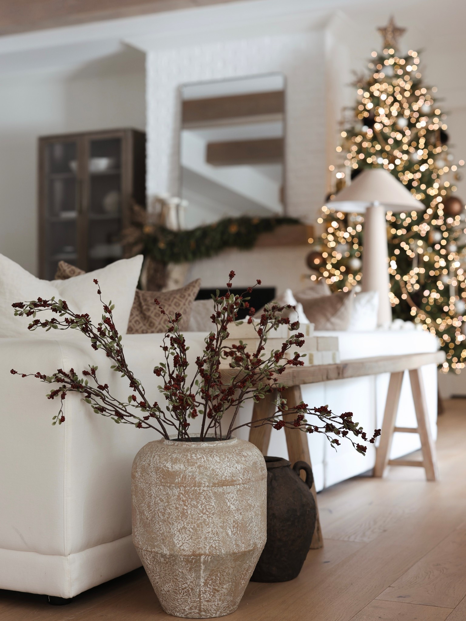 Cozy corner. Love these berry stems! 

#LTKHoliday #LTKHome #LTKFindsUnder50